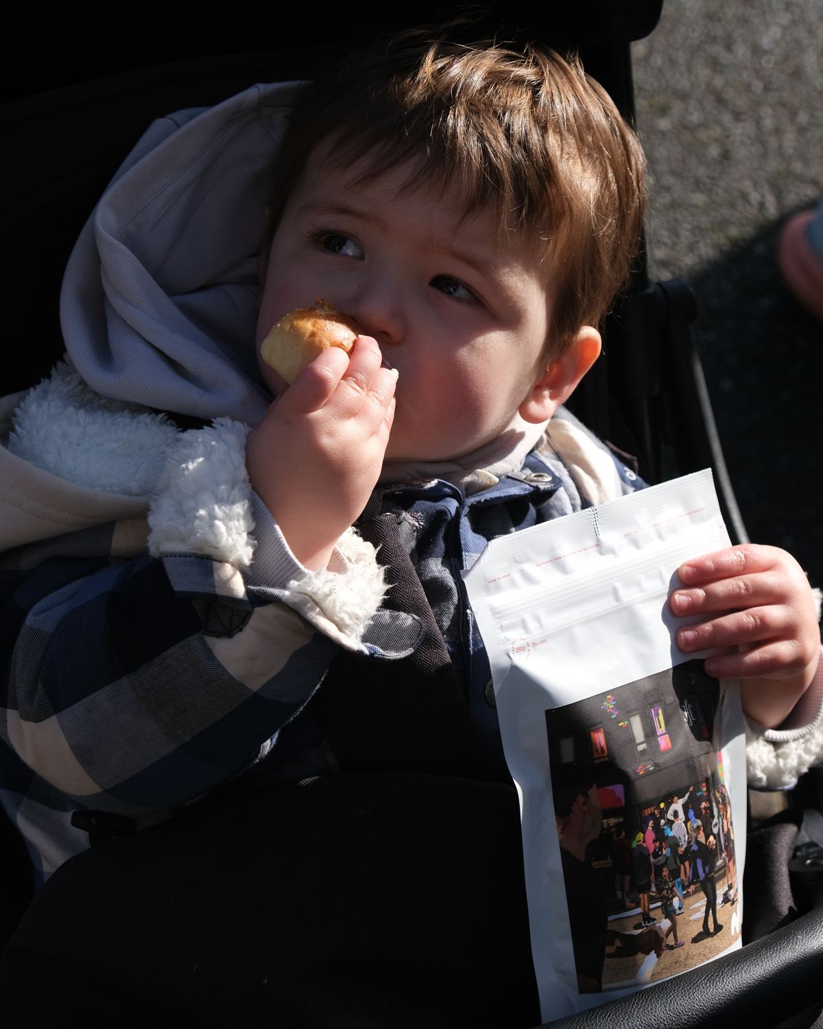 A young fan with a pastry and a bag of the Mild Activity blend.