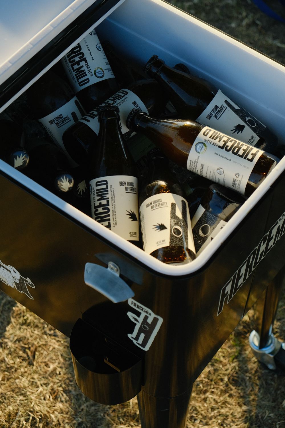 A Fierce Mild cooler full of bottles at a club event.